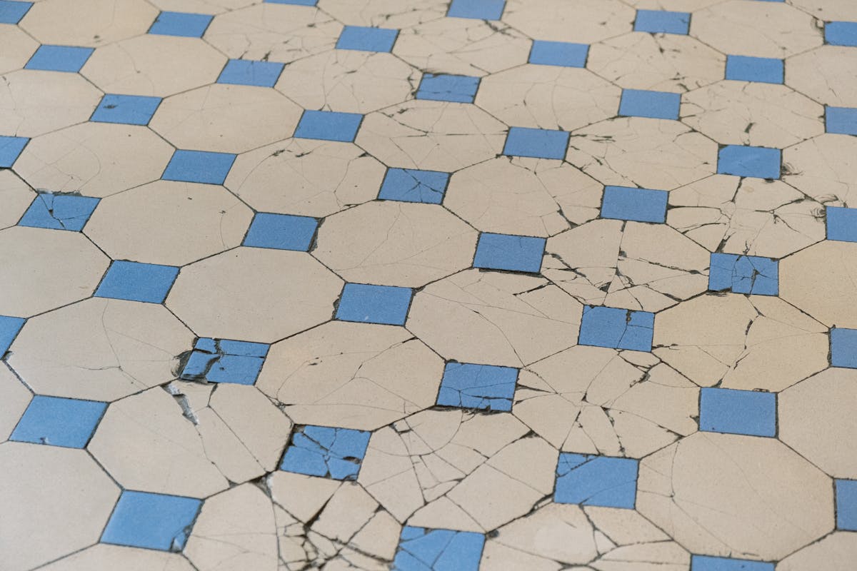 Cracked damaged tile floor ready for dustless removal in Washington County UT